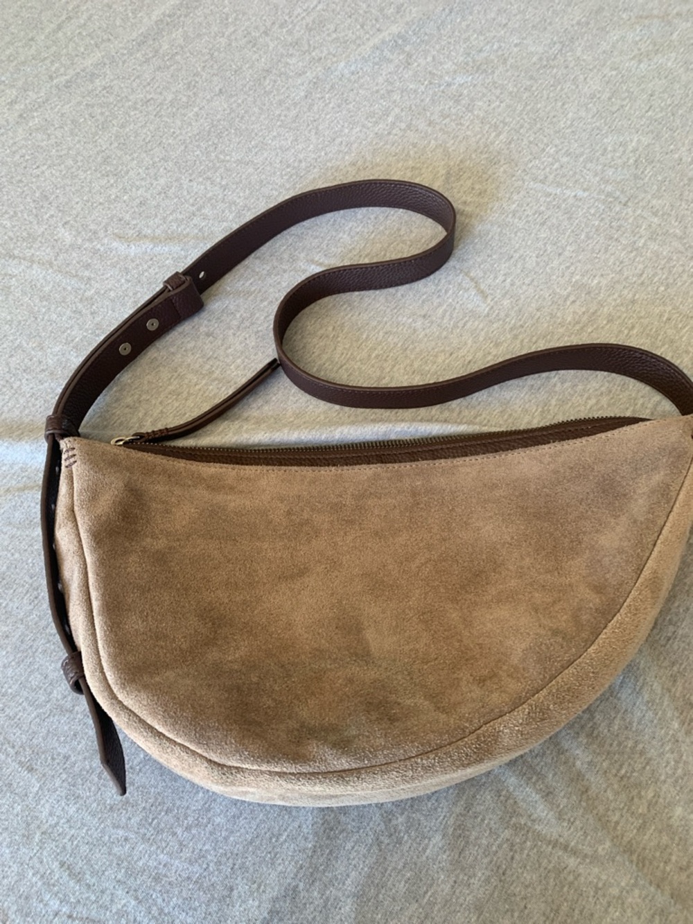 The Sak Suede Crescent Shoulder Bag in Taupe with Dark Brown Strap